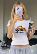 NYC Taxi Baby Tee | White New York City Graphic Crop Top - Y2K Aesthetic Tee for Women | physical by 303™ (formerly 303)